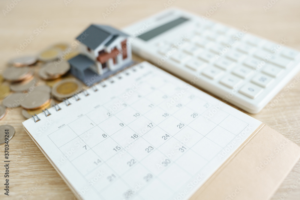Home calculators, and pens. Investing in investment in real estate Home loan using as background business concept and real estate concept with copy space for your text Home calculators, and pens. Investing in investment in real estate Home loan using as background business concept and real estate concept with copy space for your text
