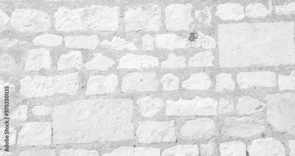 Fototapeta premium White texture of an old wall made of hewn stones - old vintage texture design - large image in high resolution