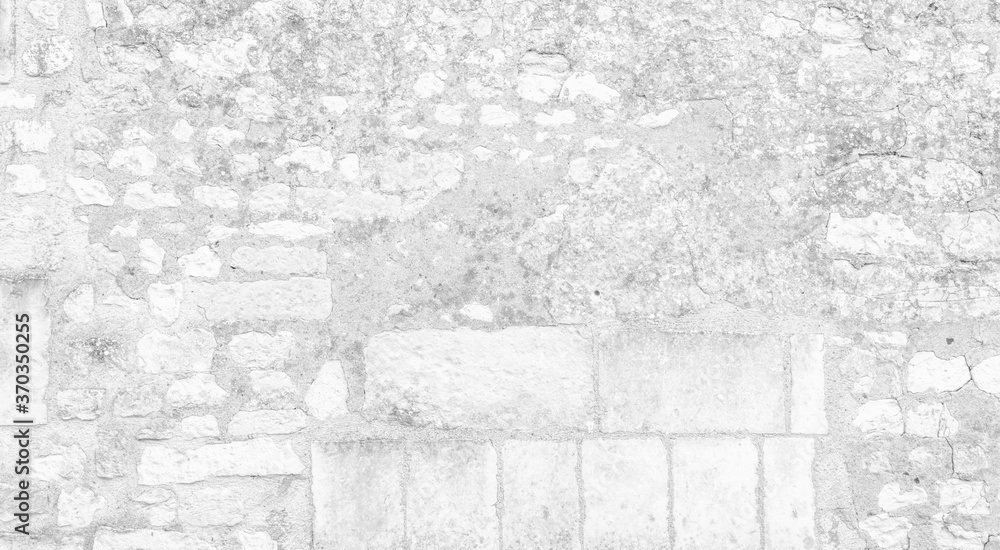 White texture of an old wall made of exposed stones - old vintage texture design - large image in high resolution	