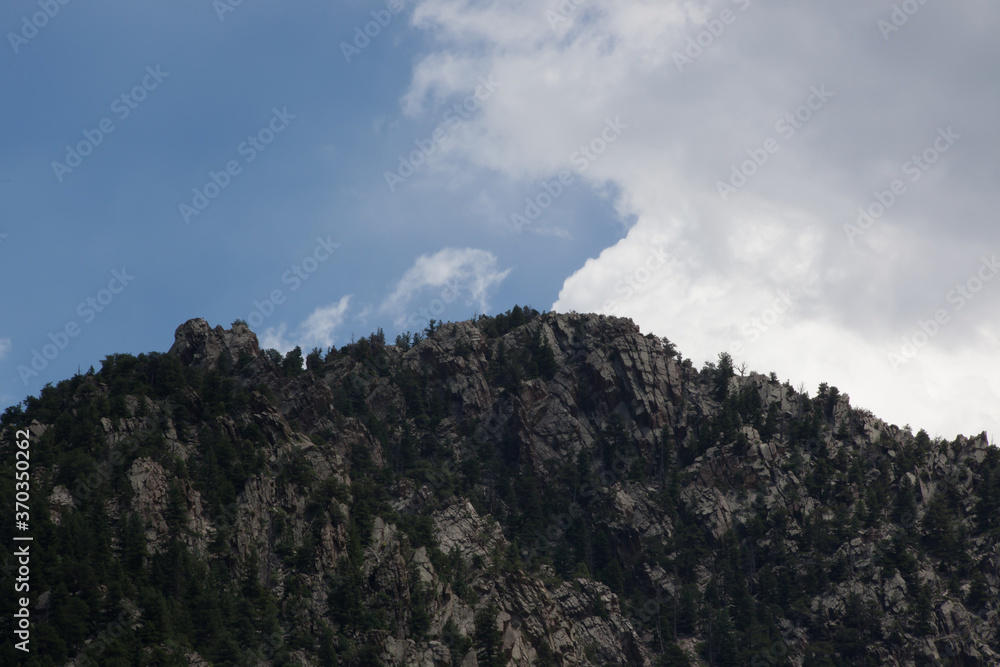 Rocky mountain against a blue sky Rocky mountain against a blue sky