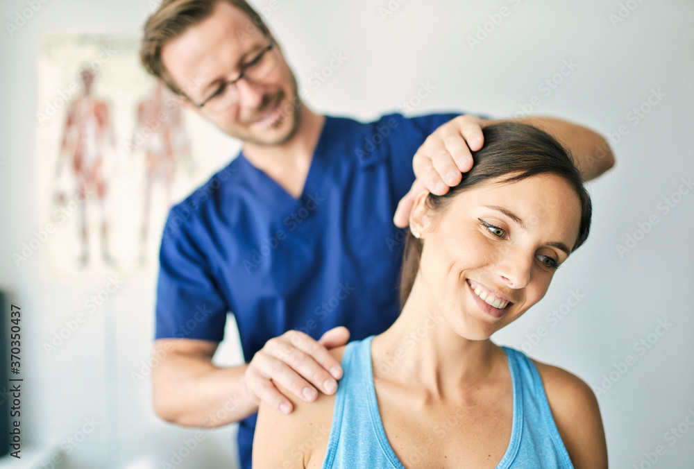 Male Physical Therapist Stretching a Female Patient nack Male Physical Therapist Stretching a Female Patient nack