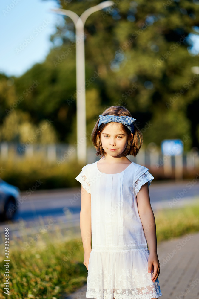 cute girl pose on the city street at sunset cute girl pose on the city street at sunset