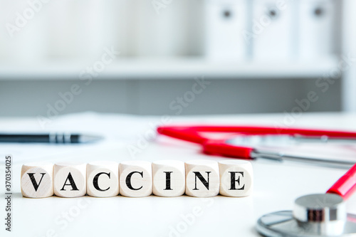 word vaccination on wooden blocks in a doctor's office