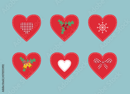 Set of six Christmas decorative patchwork hearts on blue background