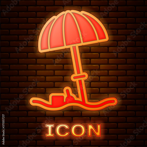 Glowing neon Sun protective umbrella for beach icon isolated on brick wall background. Large parasol for outdoor space. Beach umbrella. Vector Illustration.