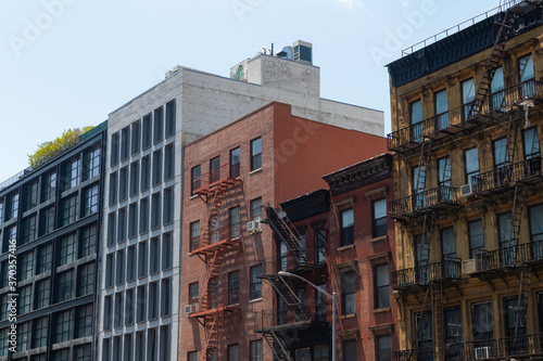 Row of Old and New Residential Buildings with Fire Escapes on the Lower East Side of New York City