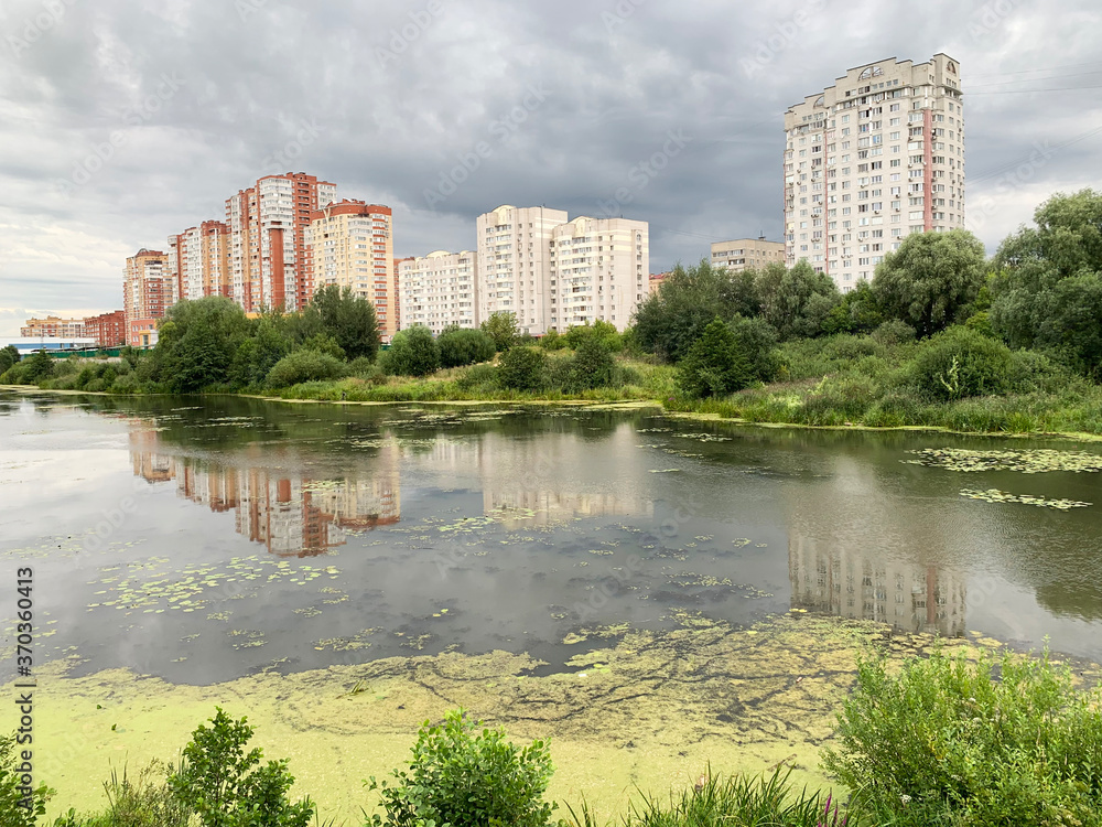 Moscow region, the city of Balashikha. Pekhorka river in summer and view of Zarechnaya street in cloudy weather