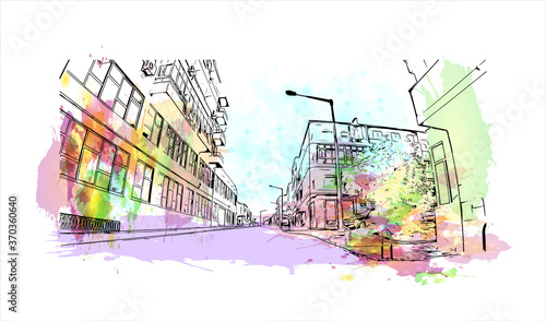 Building view with landmark of Almada is a city and a municipality in Portugal. Watercolor splash with hand drawn sketch illustration in vector.