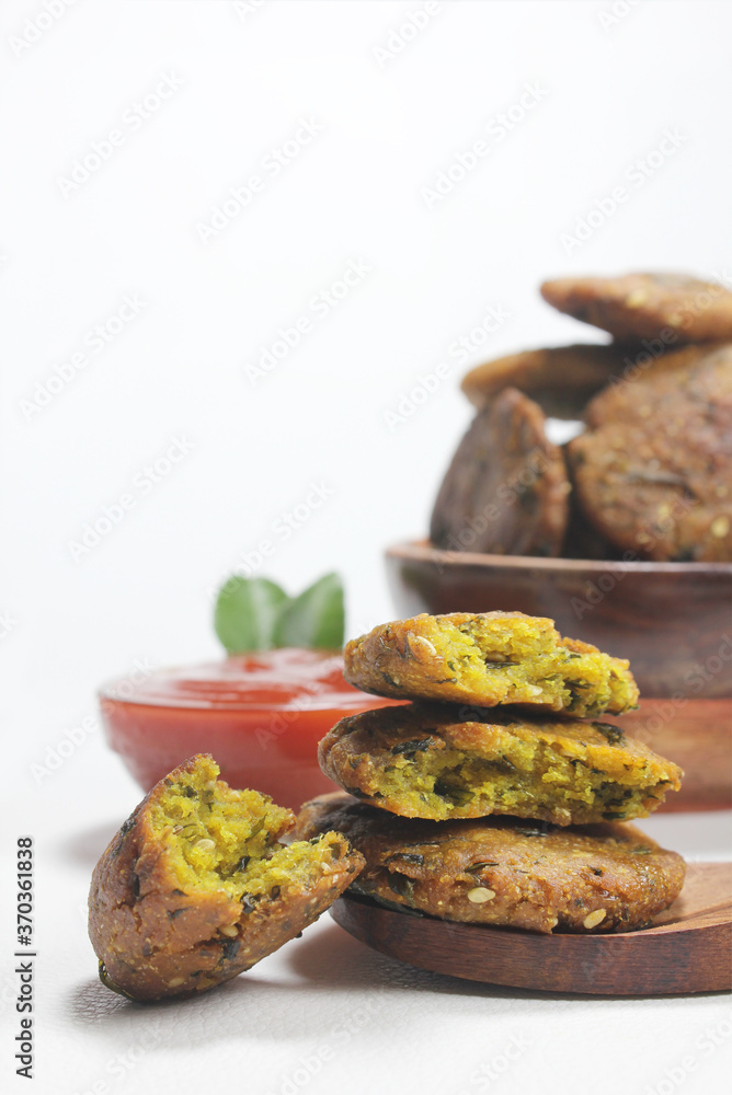 Methi na Dhebra or Methi vada or Methi bajri na vada is popular Indian tea time snacks made by Gujarati people during the month of Shravan. Methi na Dhebra or Methi vada or Methi bajri na vada is popular Indian tea time snacks made by Gujarati people during the month of Shravan.