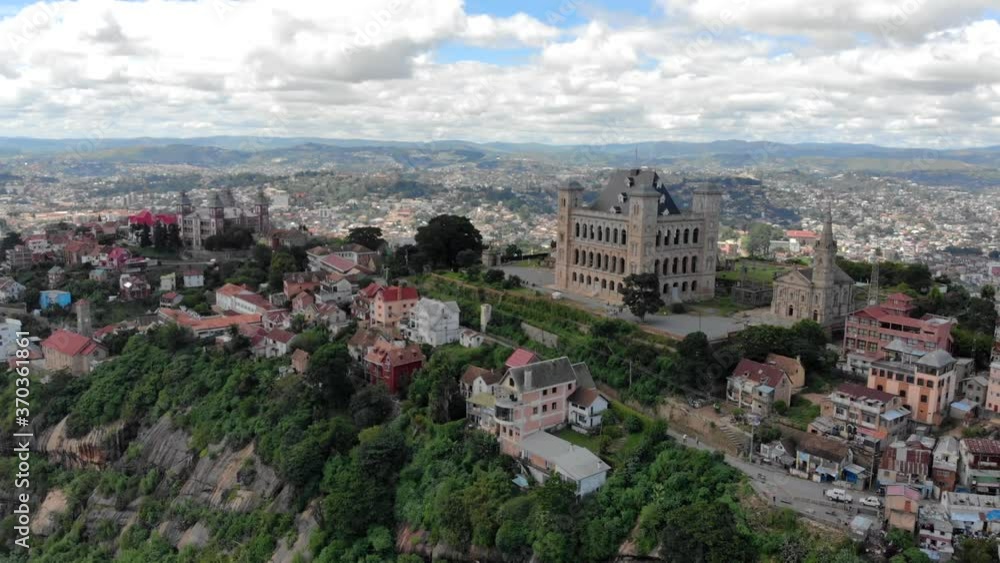 Aerial day view of the queen palace of Antananarivo in Madagascar, also called Rova Manjakamiadana with its cityscape, paved streets and old colonial houses, must-see landmark Aerial day view of the queen palace of Antananarivo in Madagascar, also called Rova Manjakamiadana with its cityscape, paved streets and old colonial houses, must-see landmark