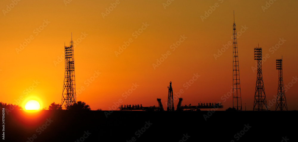 Pre-launch of Spaceship in the spaceport. Silhouette of space shuttle at dusk. Mixed media