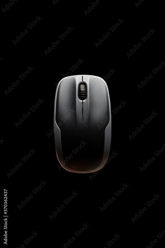 above view of computer mouse on black background. black and grey computer mouse. computer mouse isolated on the black background. above view of computer mouse on black background. black and grey computer mouse. computer mouse isolated on the black background.