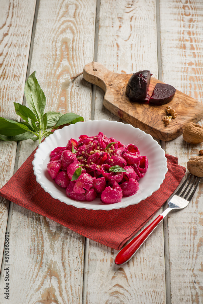 pasta with beet pesto nuts and basil