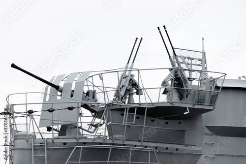Three air defense FLAK guns mounted on a German historical military submarine from 1942