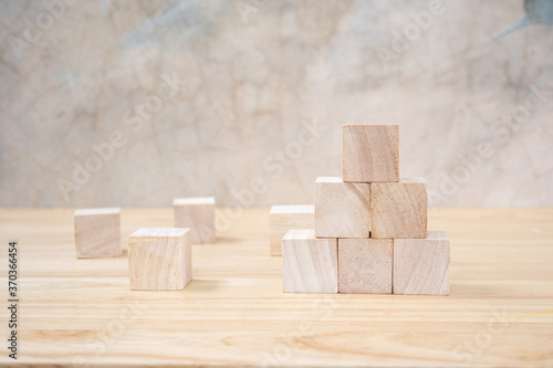 Fototapeta Naklejka Na Ścianę i Meble -  Wooden toy cubes on wooden table ang grey background