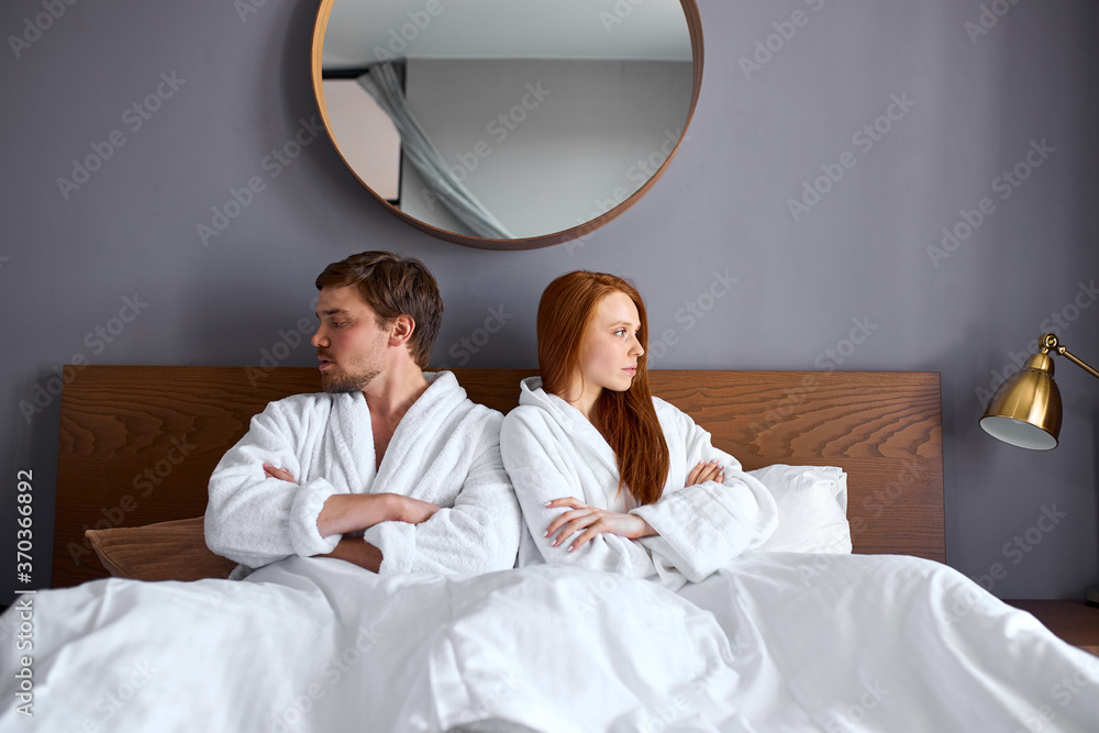 couple offended at each other, they have a difficult relationship. redhead woman and bearded guy sit in silence after quarreling couple offended at each other, they have a difficult relationship. redhead woman and bearded guy sit in silence after quarreling