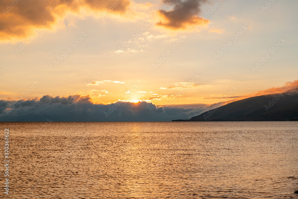 Beautiful landscape. Bright golden sunset with dramatics clouds over the lake. Beautiful landscape. Bright golden sunset with dramatics clouds over the lake.