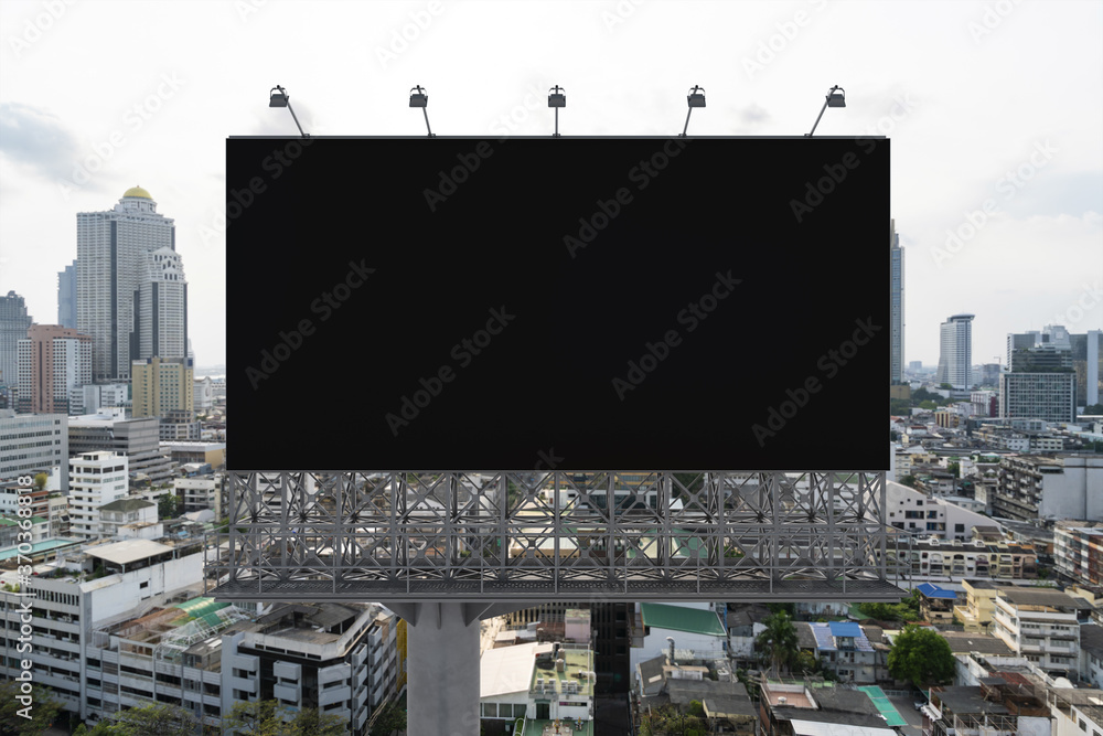 Blank black road billboard with Bangkok cityscape background at day time. Street advertising poster, mock up, 3D rendering. Front view. The concept of marketing communication to promote or sell idea. Blank black road billboard with Bangkok cityscape background at day time. Street advertising poster, mock up, 3D rendering. Front view. The concept of marketing communication to promote or sell idea.