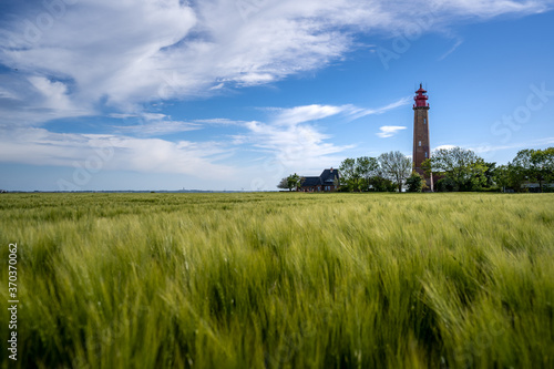 The beautiful Lighthouse Of Flügge On The Isle Of Fehmarn at the Baltic Sea in Germany. Summer in Germany. 