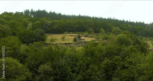 Hydraulic energy water mill in the ethnographic complex Os Teixois in Taramundi, Asturias Spain photo