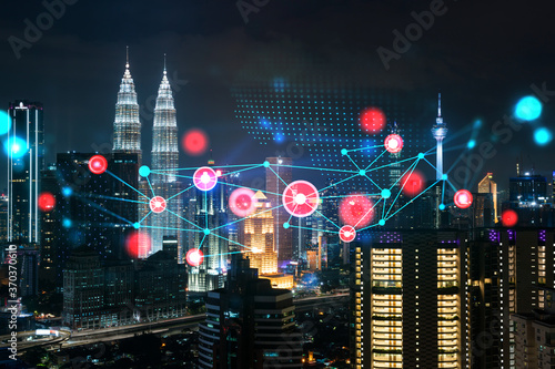 Canvas Print Abstract technology icons, night aerial panoramic cityscape of Kuala Lumpur, Malaysia, Asia