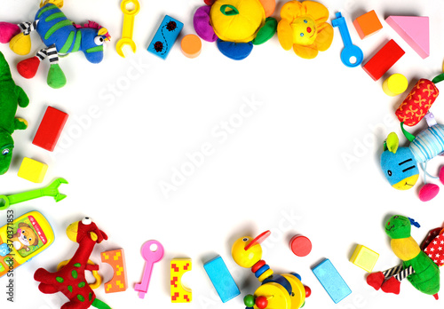 Baby toys frame. Colorful kids toys on white background. Copy space for text. Top view. Flat lay.