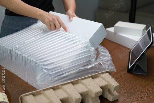 Packing products for delivery, shipping service. Translucent air packaging, protection of goods, bubble wrap packaging.