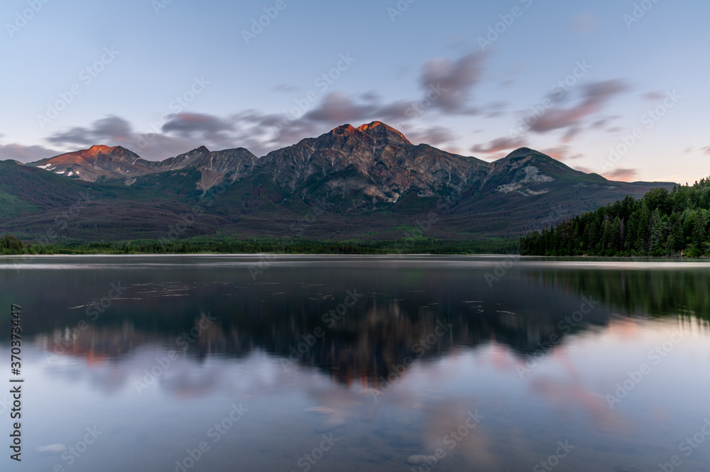 View of Pyramid Lake in Jasper National Park at sunrise. 