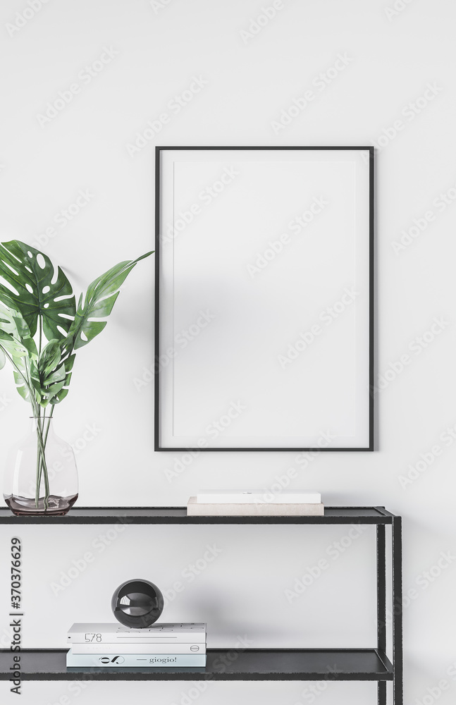 Fototapeta Design modern interior of living room with black metal console, green leaves in vase, mock up poster frame and elegant accessories. Stylish home interior. trendy home decor.