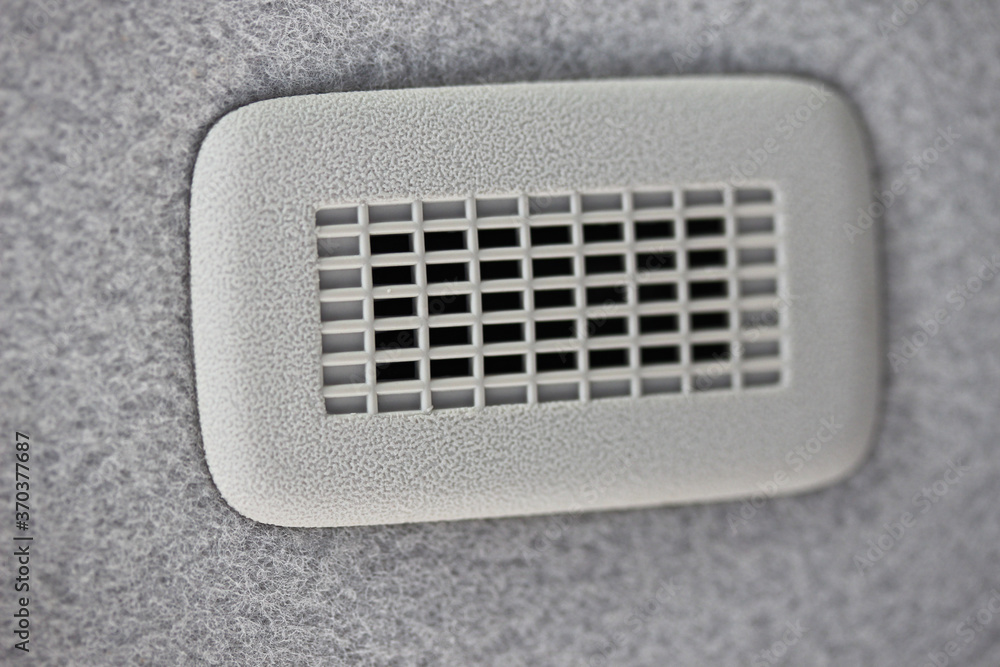 Microphone grill in vehicle ceiling Microphone grill in vehicle ceiling