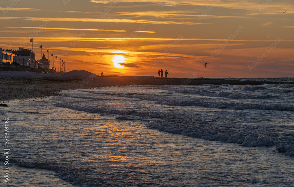 Langrune Sur Mer, France - 08 03 2020: Panoramic view of the sea from the beach at sunset