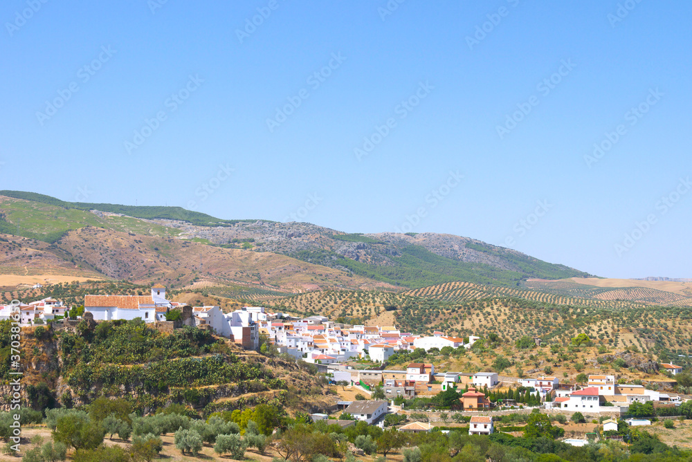 View over the town rooftops in the distance, Medina Sidonia, Cadiz Province, Andalusia, Spain.