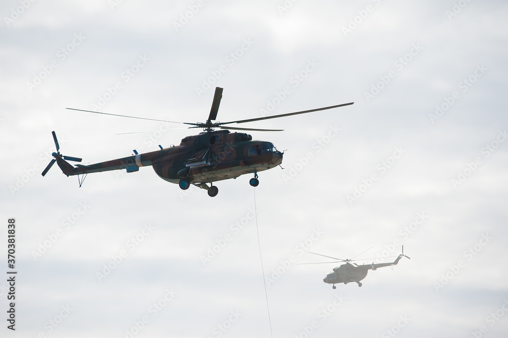 Military helicopter flying during exercise Military helicopter flying during exercise