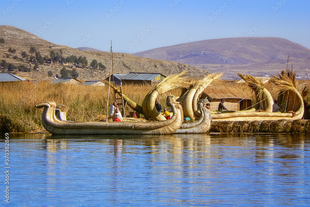 Uro worker men building totora reed boats, floating Uros Islands, Lake ...