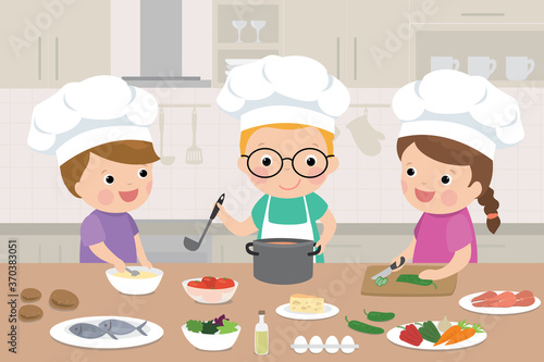 Happy children is cooking in the kitchen. Kitchen interior with furniture on background.