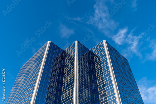 Generic office building concept with blue sky. 