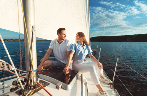 Couple Holding Hands Enjoying Yacht Ride Spending Vacation On River © Prostock-studio