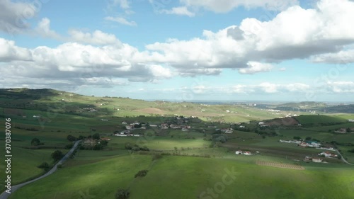 Aerial wide shot over evergreen countryside valley on Cloudy day, Portugal photo