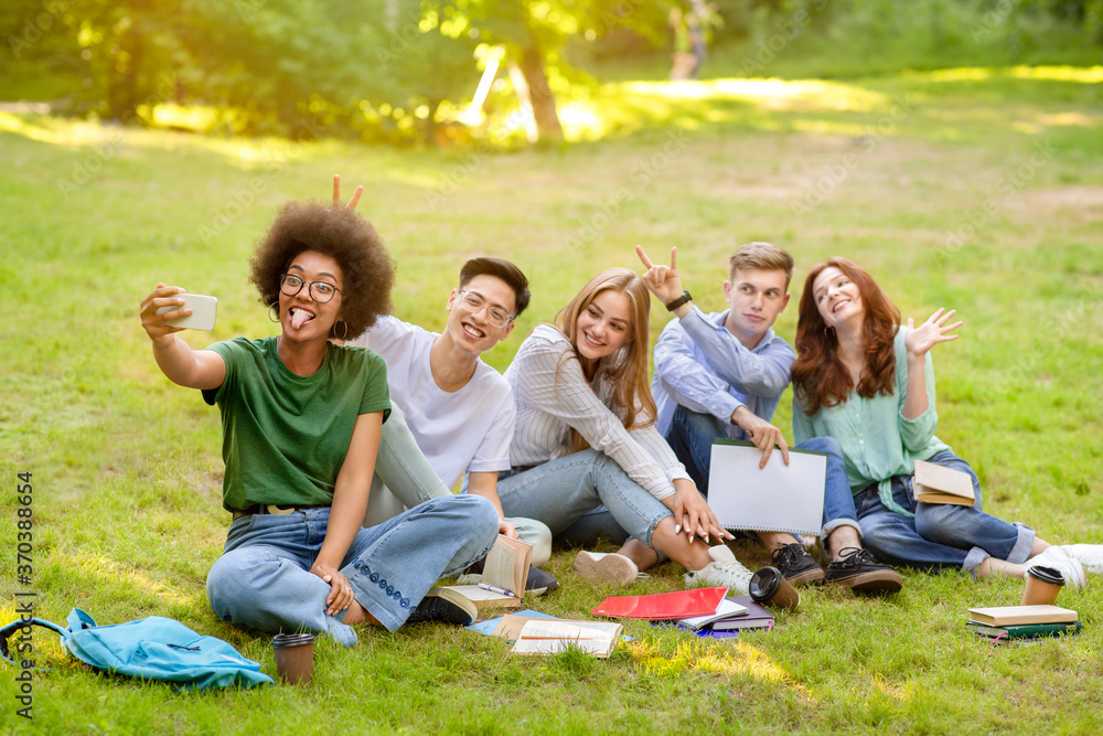 Selfie Fun. Group Of Multiracial Students Fooling While Taking Group Photo Outdoors Selfie Fun. Group Of Multiracial Students Fooling While Taking Group Photo Outdoors