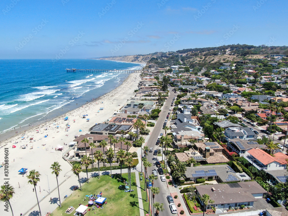 Aerial view of La Jolla bay with nice small waves and tourist enjoying the beach and summer day. La Jolla, San Diego, California, USA. Beach with pacific ocean