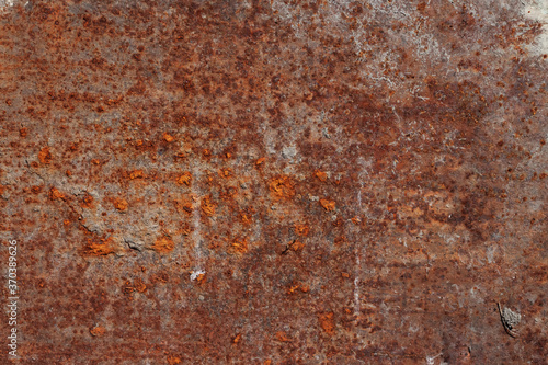 Orange rusty metal aged shabby industrial grunge texture pattern for macro wallpaper or background