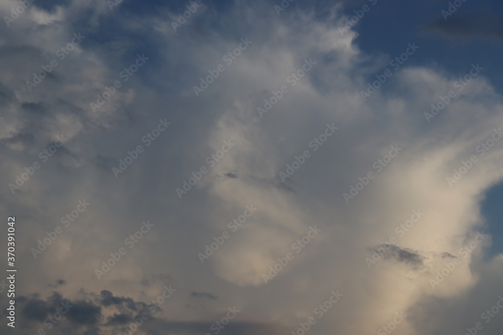 white and black clouds in the blue sky