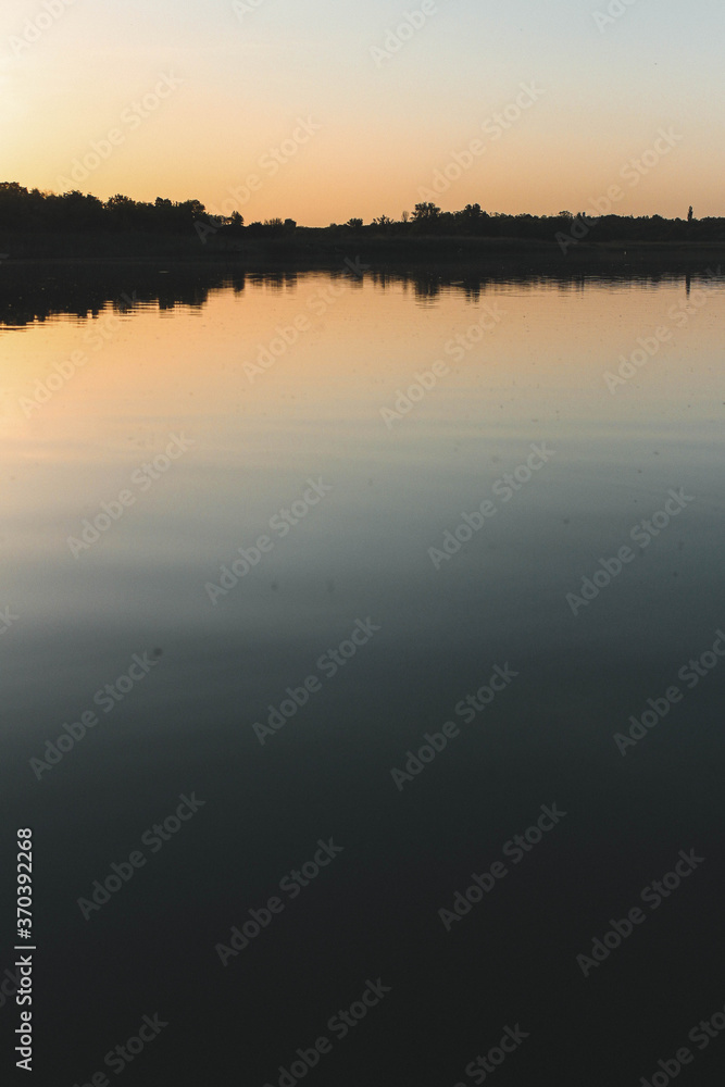 Fototapeta premium sunset over the lake