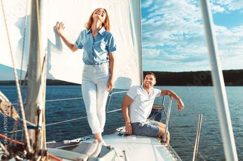 Couple Having Fun On Luxury Yacht Enjoying Boat Tour Outdoors © Prostock-studio