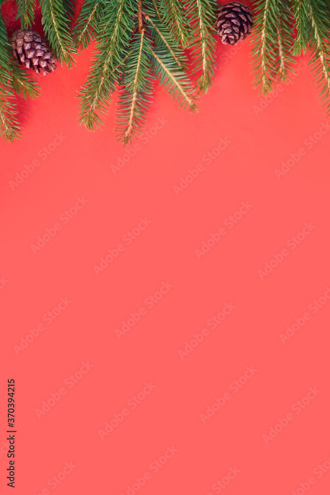 Christmas background with xmas tree on red canvas background. Merry christmas card. Winter holiday theme. Happy New Year. Space for text. christmas backdrop top view. Flat lay.