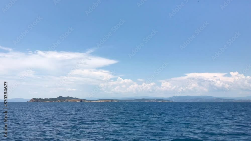 Approaching Ammoulliani island in Halkidiki Greece from the sailing ship in 4k Approaching Ammoulliani island in Halkidiki Greece from the sailing ship in 4k