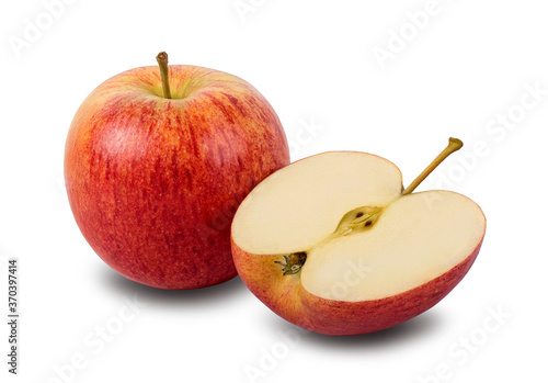 Whole and half red yellow apple with green leaf isolated on a white background. Clipping path included.