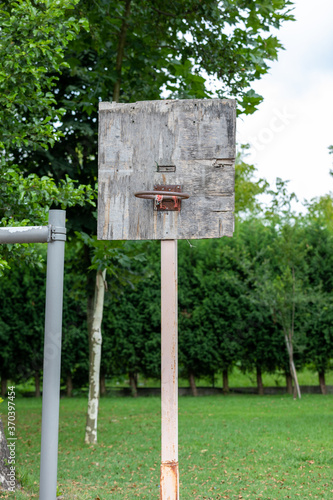 The old basketball hoop made of wood.