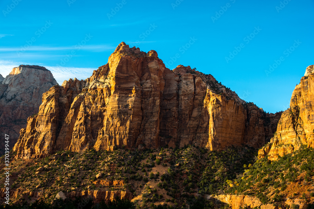 Mountain in the sunset light. Zion's cliff in evening colors. Mountain in the sunset light. Zion's cliff in evening colors.