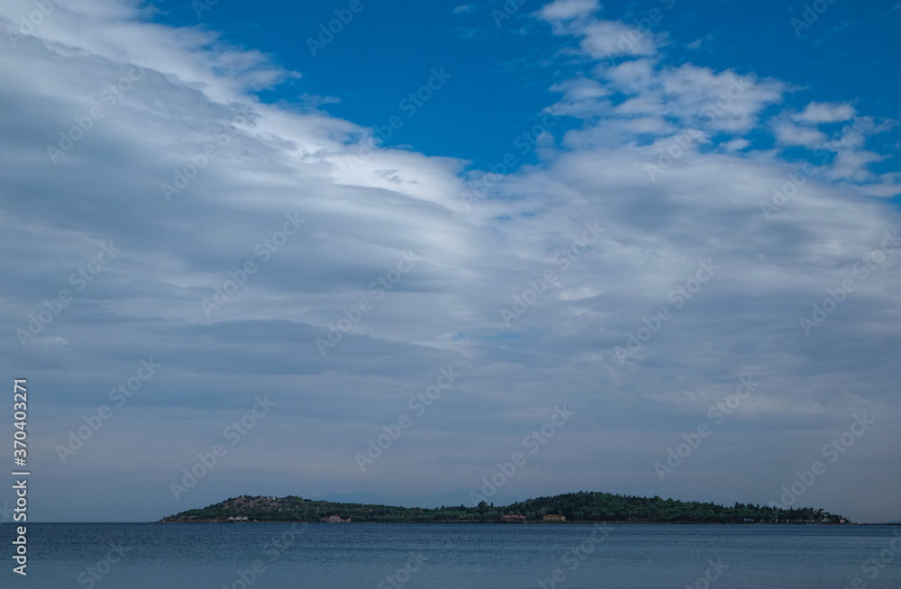 Fototapeta premium island, sea and cloudy sky, urla, izmir